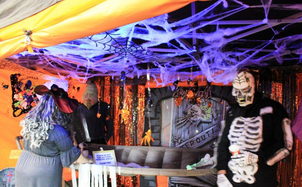 Branded gazebo lit up at an evening event