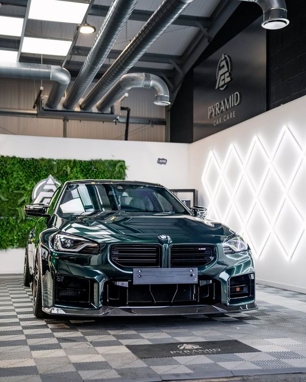 BMW M2 in a detailing studio with Swisstrax Ribtrax