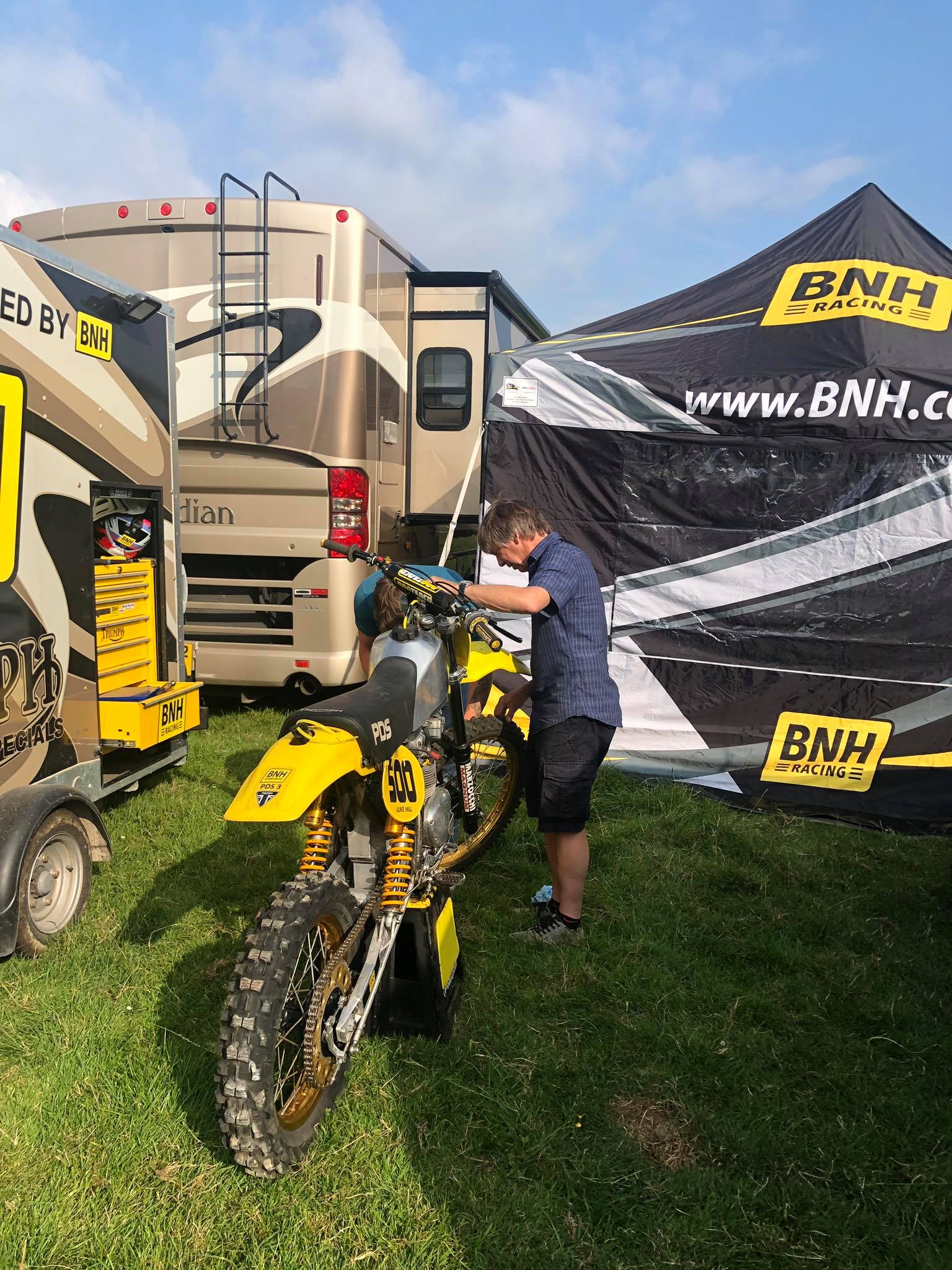 Young rider and family at a club motocross meeting