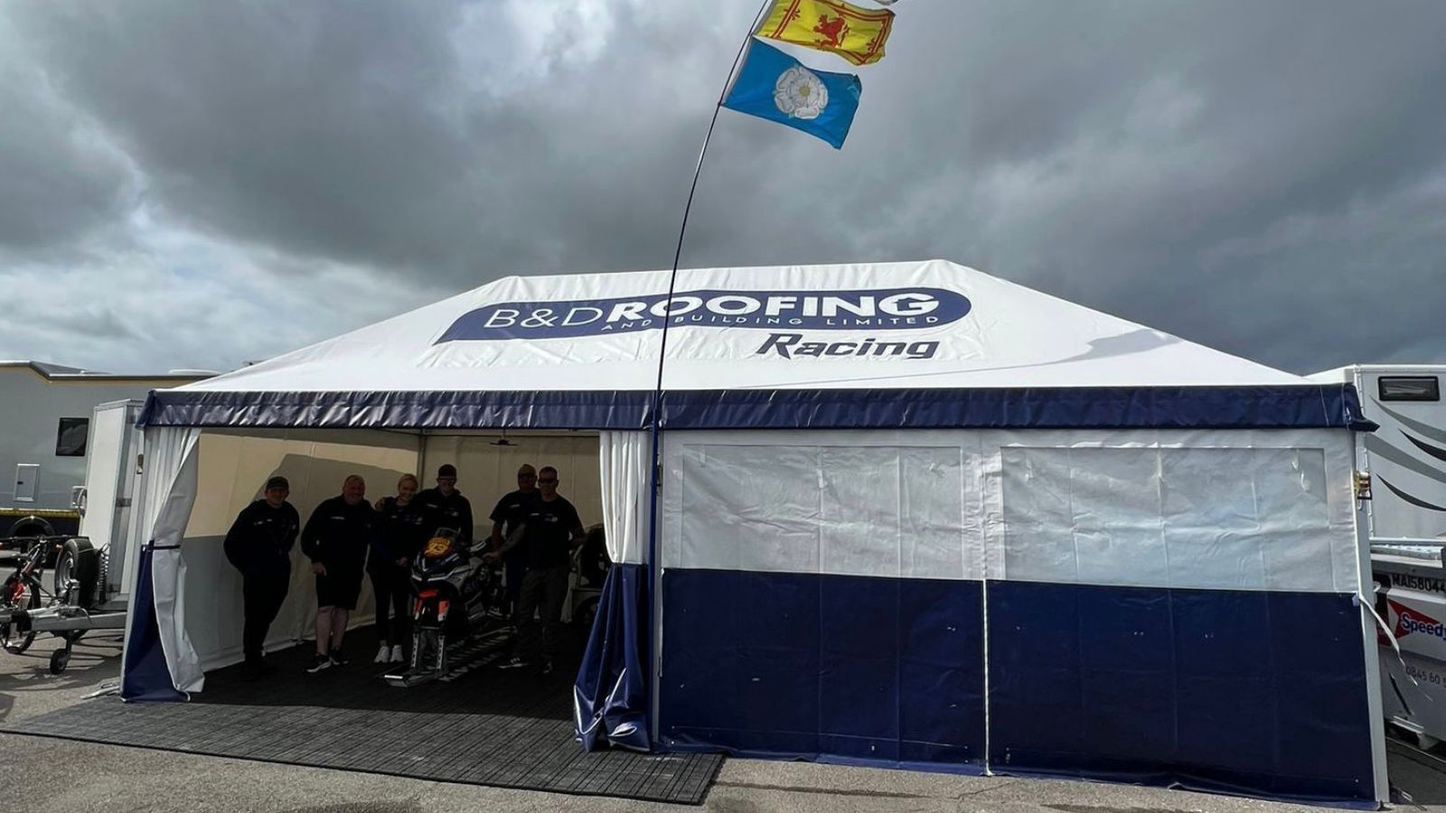 large branded marquee for motorbike race team
