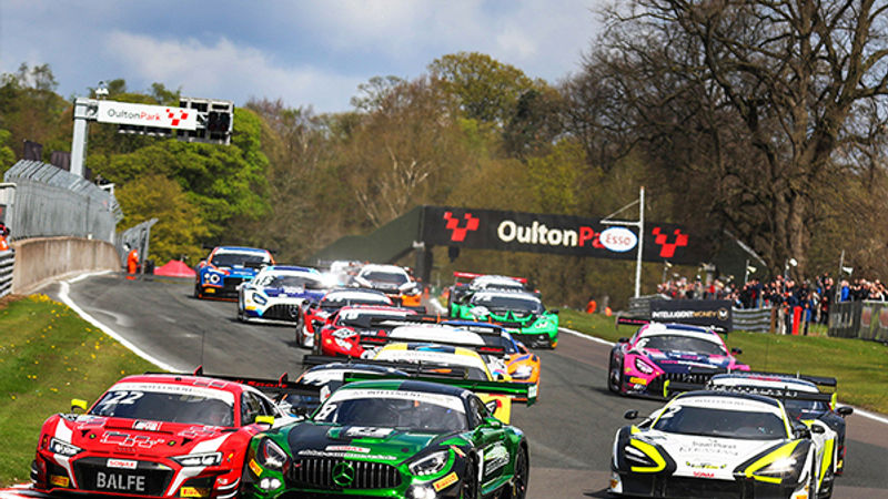 Car cresting a rise at Oulton Park