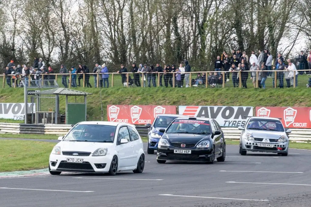 Car braking hard for Quarry Corner at Castle Combe
