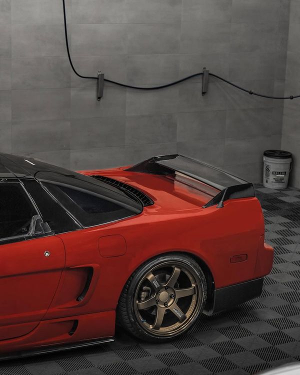 Honda NSX in a home garage with grey Swisstrax Ribtrax