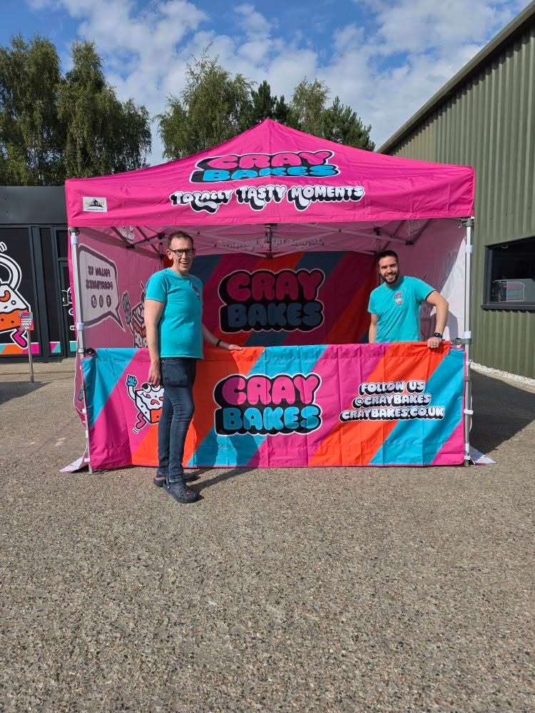 Branded gazebo in strong brand colours at an outdoor event