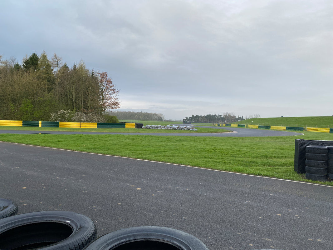 Car through the Jim Clark Esses at Croft