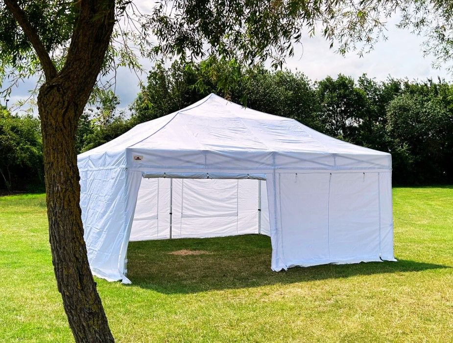 Large white pop up marquee on a field