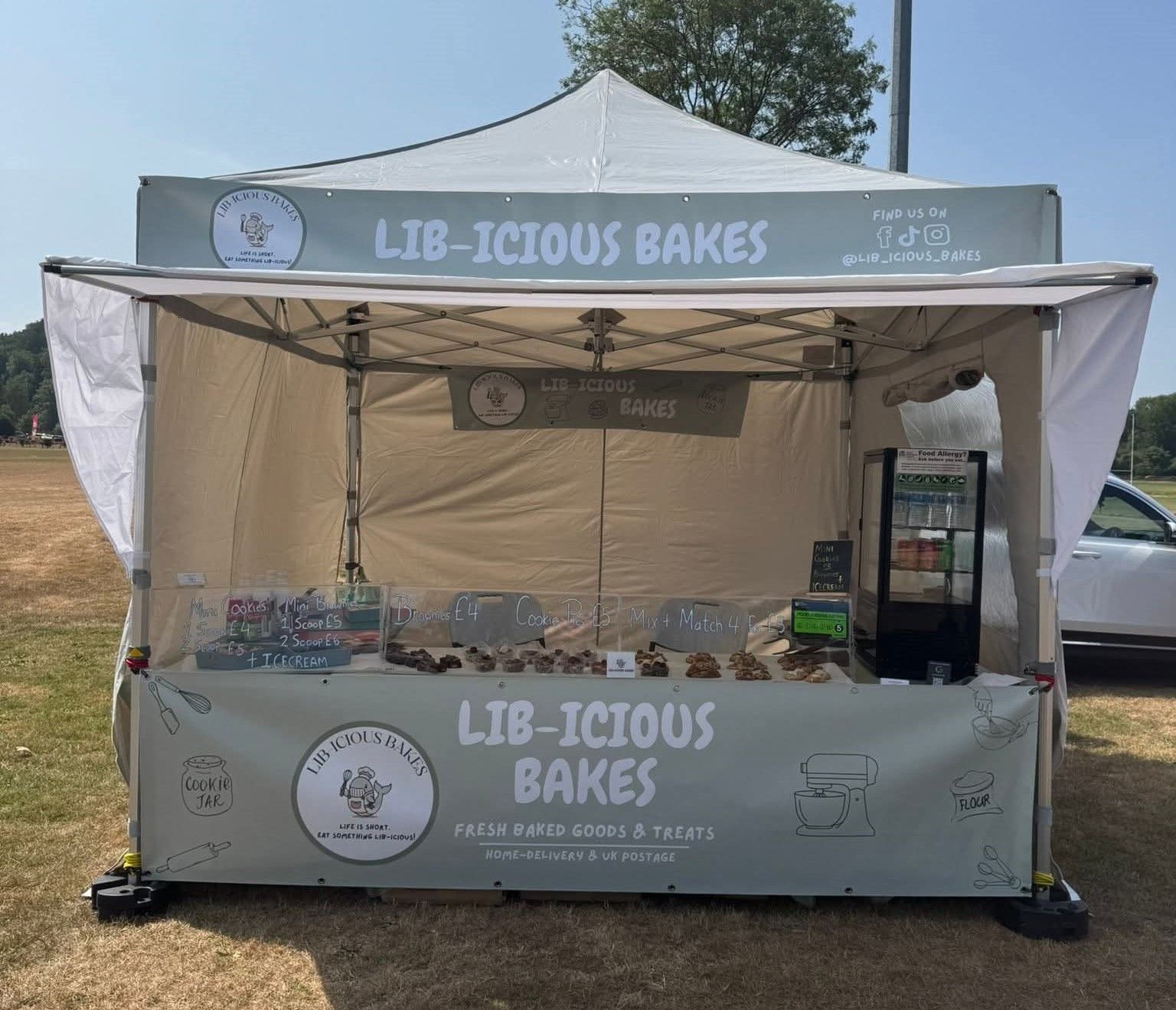 Lib-icious Bakes market stall under a 3m x 3m Pro 50 gazebo with sun shade awning