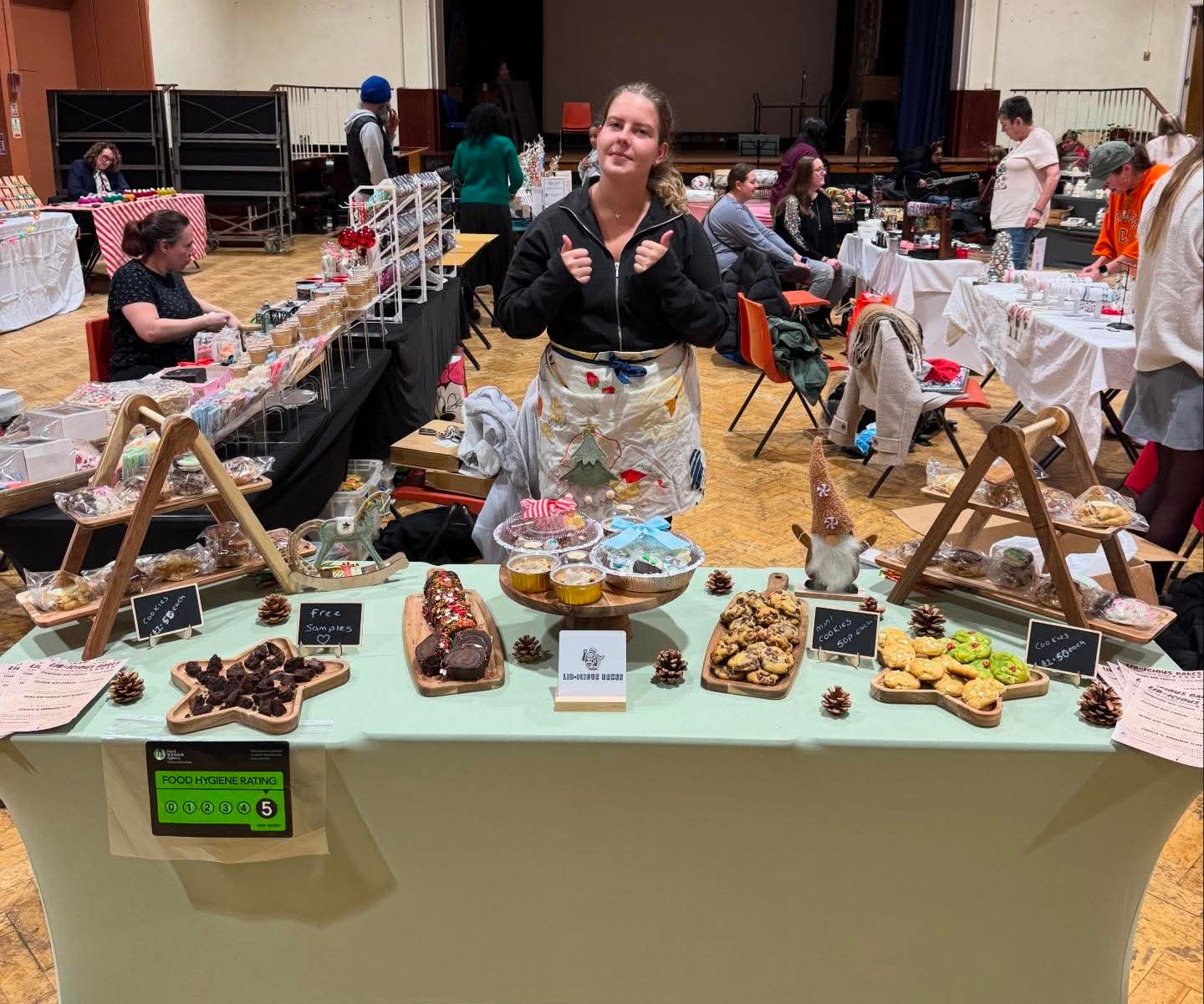 Libby, founder of Lib-icious Bakes, at her market stall