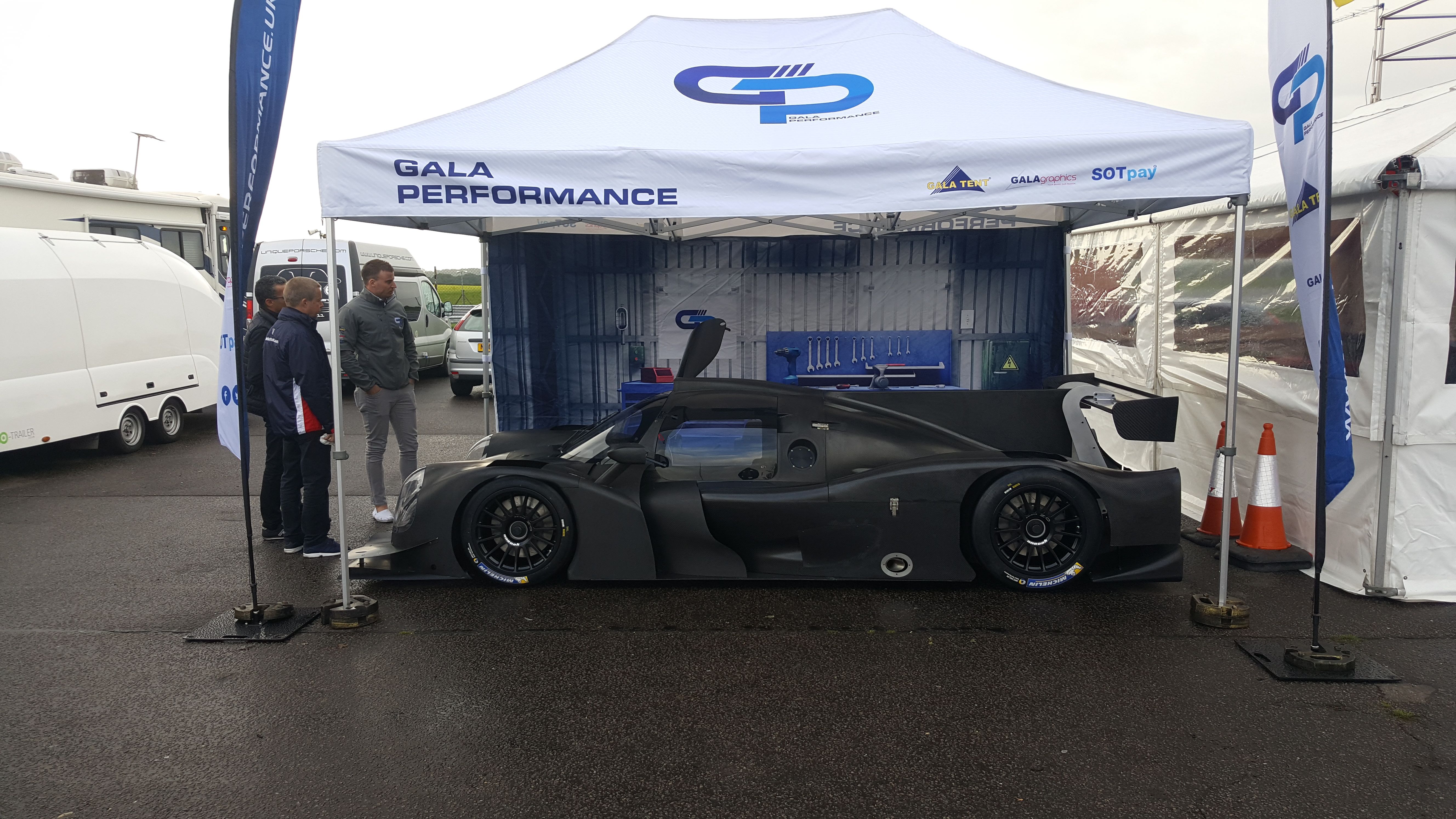 Race car beneath a Gala Performance branded awning