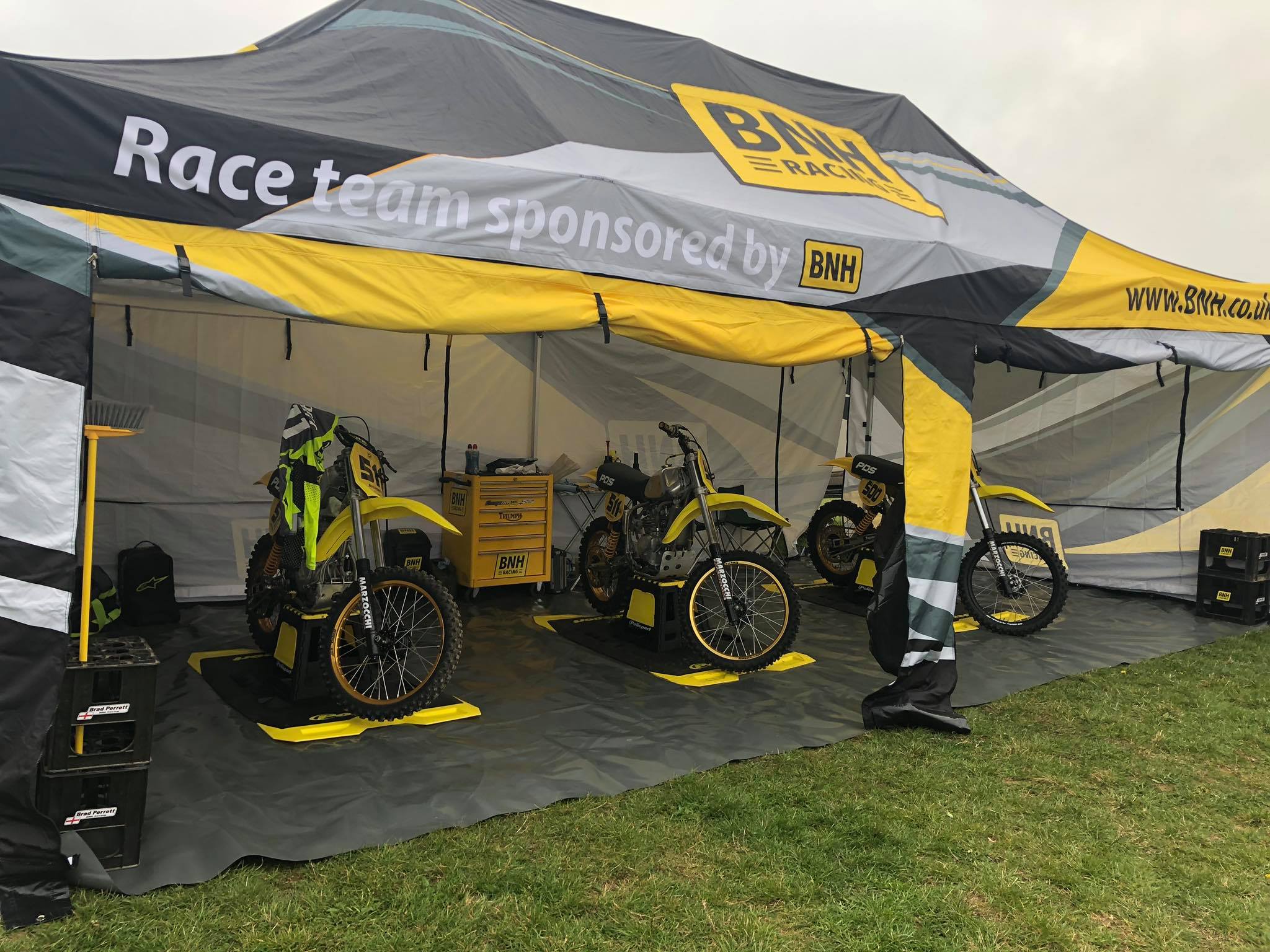 BNH Racing branded motorcycle tent