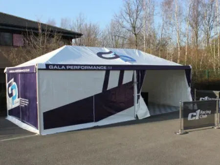 blue and white branded marquee in car park