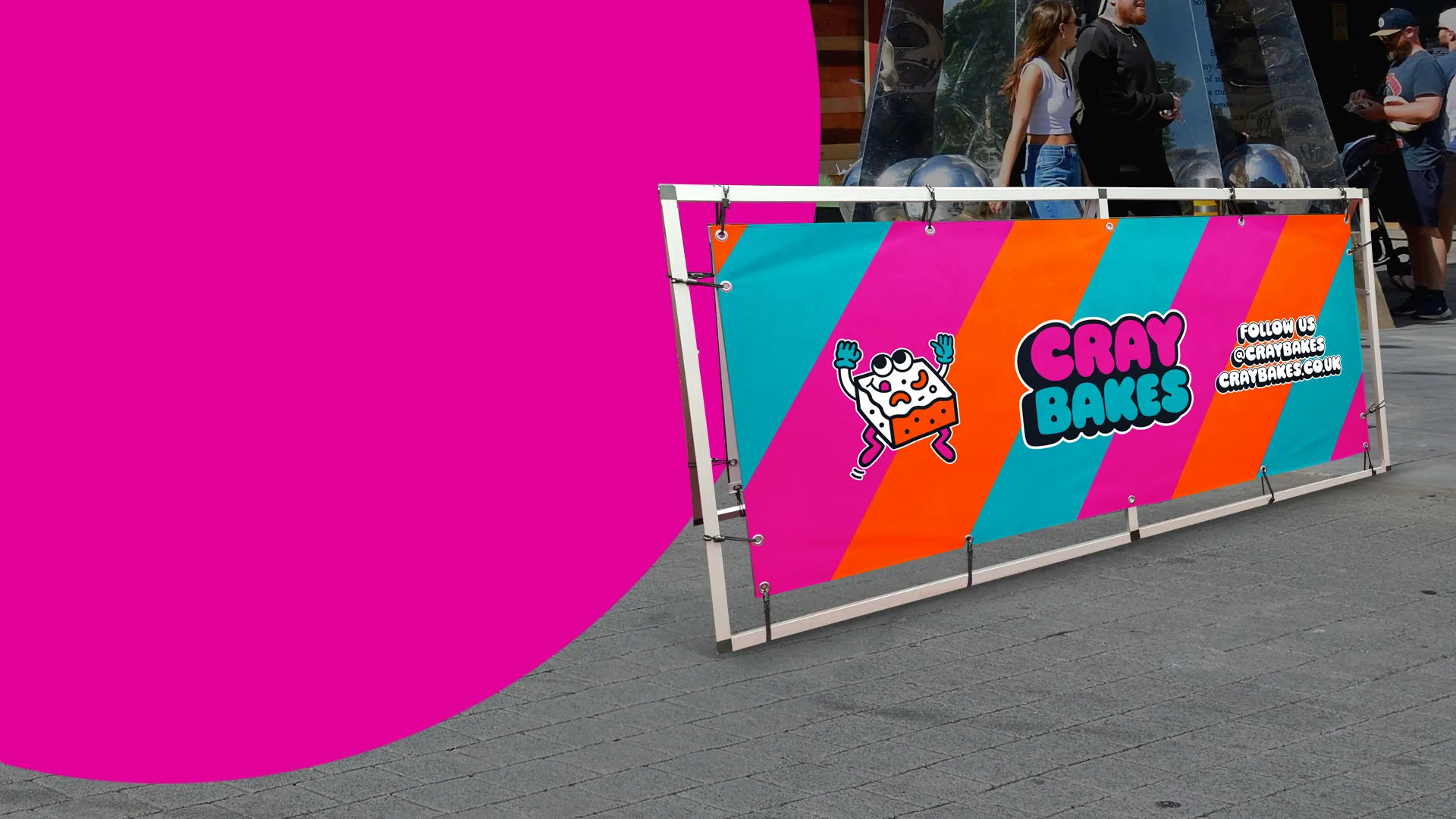 A brightly coloured branded outdoor banner on pink overlay background
