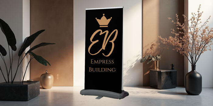 Black upright banner branded with Empress Building
