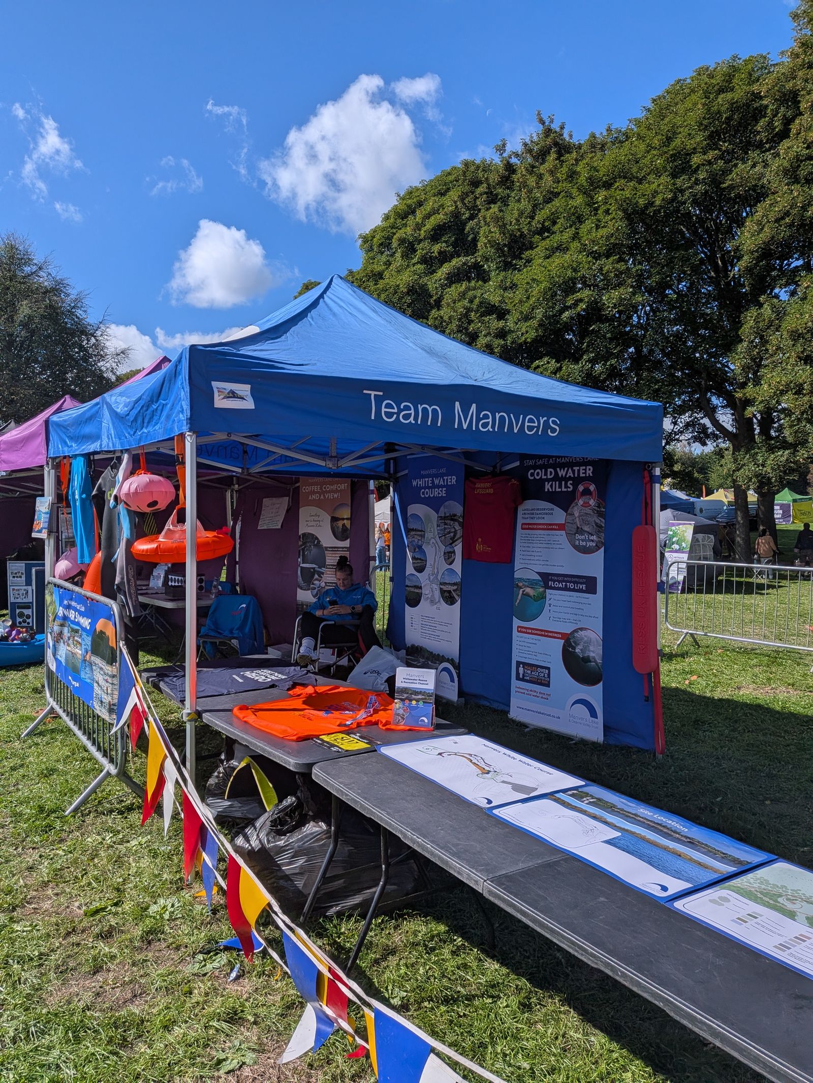 branded gazebo in use at a busy outdoor event