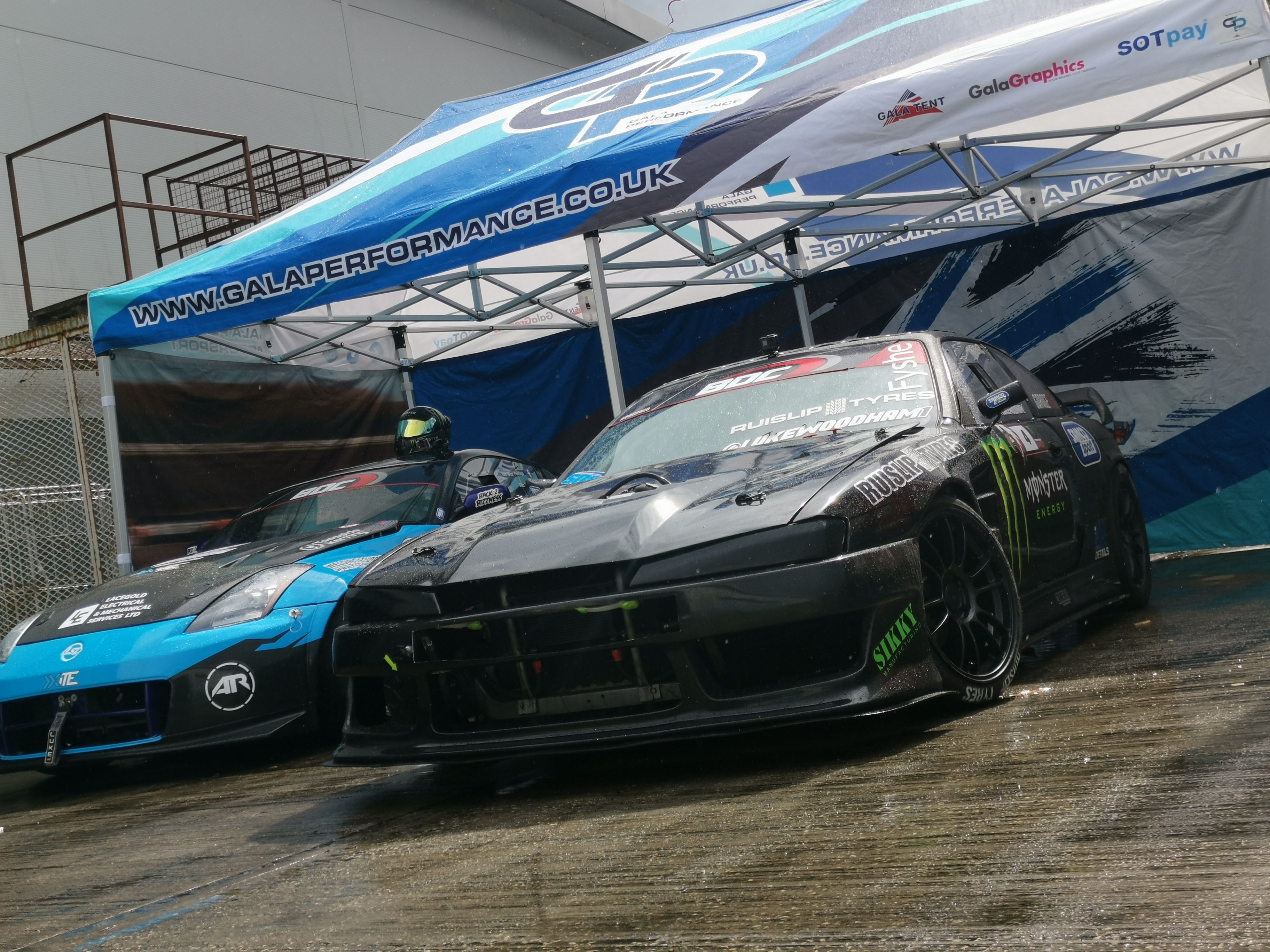Competition car and pop up awning in a hillclimb paddock
