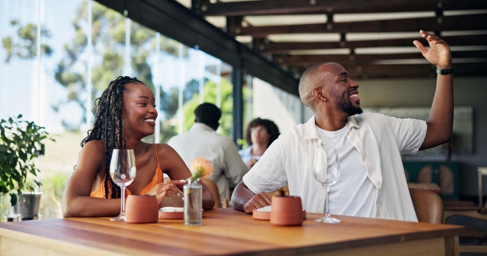Restaurant guests waiting to pay the bill at a busy table