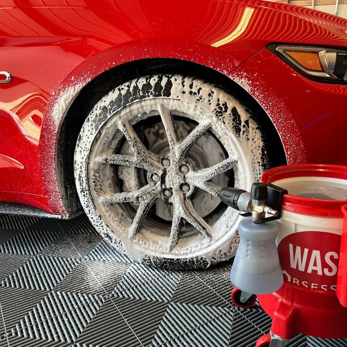 Cleaning a tyre on a Swisstrax Ribtrax floor